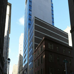 Building facade showing the office structure next to a classic brick building.