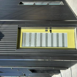 Modern door featuring a bright lime green frame and privacy glass.