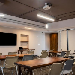 Two-person office setup with industrial-style wooden desks.