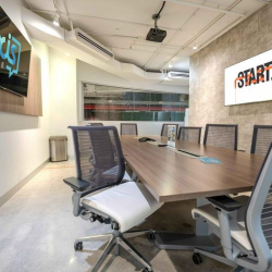 Classroom-style setting with a chalkboard for group brainstorming.