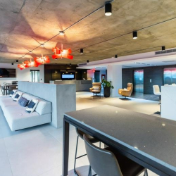 Spacious modern lounge with white sofa and industrial lighting, Avenida Juan Ponce de León, San Juan