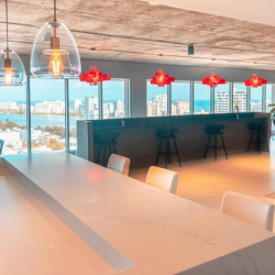 Bright breakout area featuring bar seating and city views, Avenida Juan Ponce de León, San Juan