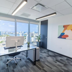 Private corner office with glass desk and expansive views, Avenida Juan Ponce de León, San Juan