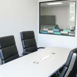 Spacious classroom setup with wooden desks and ergonomic seating, 1903 Central Drive, Bedford, Texas.