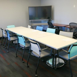Professional meeting room with U-shaped table and large windows, 1903 Central Drive, Bedford, Texas.
