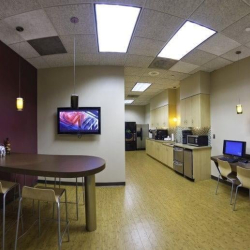 Office breakroom and kitchen with seating and workstations, Colony Square, 1201 Peachtree Street NE, Atlanta