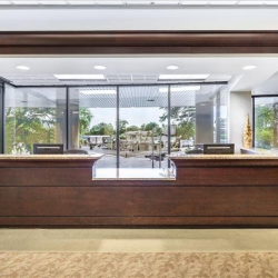 Professional reception desk in a bright, spacious lobby area, Clairemont Avenue Business Centre, Decatur, Atlanta