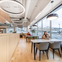 Bright workspace along window facade with modern seating, Traverse Ridge Center III, Lehi, Utah