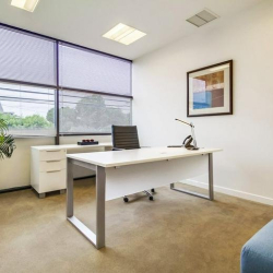 Private executive office with desk, large windows, and natural light, Marina Del Rey, California.
