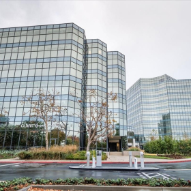 Exterior view of the glass-facade West Tower at Birch Street Center, 5000 Birch Street.. Click for details.