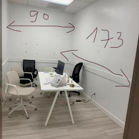 Private office room at 5021 Kingsway, Unit #114 featuring a white desk, chairs, and wall measurements.. Click for details.