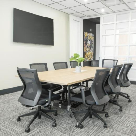 Modern open-plan workspace featuring a core values wall graphic and polished floors.. Click for details.